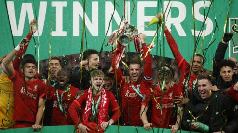 Liverpool celebrate winning this season's League Cup after beating Chelsea in the final