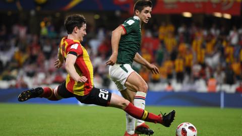 Ayman Ben Mohamed makes a tackle at the Club World Cup