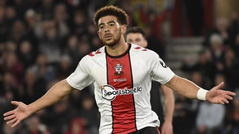 Che Adams celebrates scoring for Southampton against Lincoln