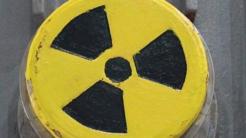 A symbol for radioactivity on a radioactively-contaminated container once used to transport nuclear fuel rods