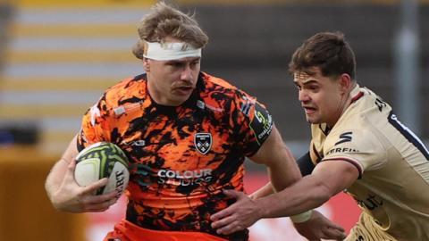 Dragons number eight Aaron Wainwright carries the ball in the win against Lyon at Rodney Parade