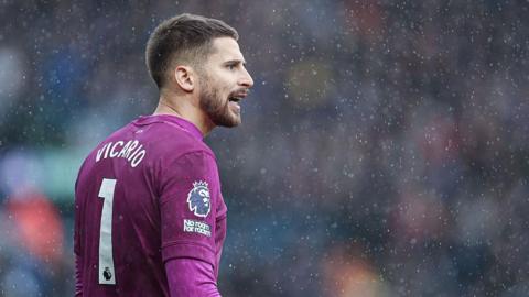 Guglielmo Vicario in action during the Premier League match between Leeds and Tottenham