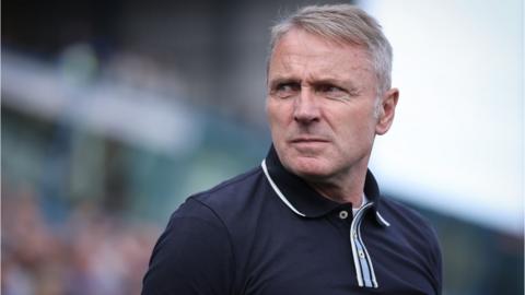 Paul Simpson looks on before Carlisle's home game with Shrewsbury