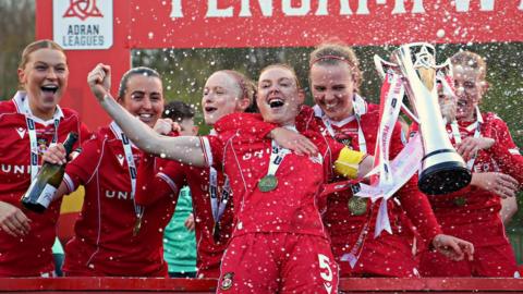 Wrexham players celebrate with Adran Premier trophy