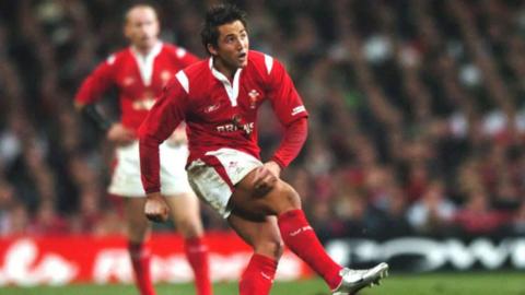 Gavin Henson kicks the winning conversion against England