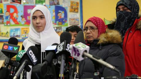 Khawlah Noman, 11, speaks to reporters with her mother at Pauline Johnson Junior Public School, after she told police that a man cut her hijab with scissors in Toronto, Ontario