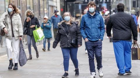 People wear masks in Manchester city centre