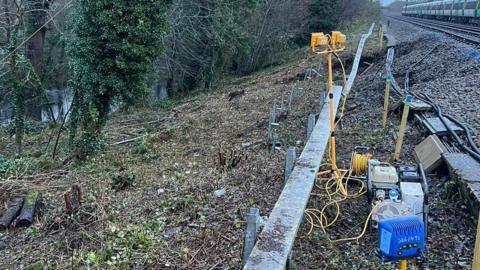 A view of the collapsed embankment next to the Brighton main line 