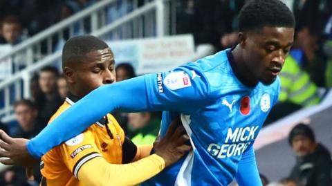 Kwame Poku playing for Peterborough against Cambridge