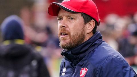 Darrell Clarke standing on the sidelines for Cheltenham