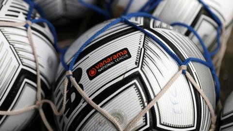 Footballs with National League emblem on them