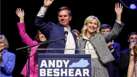 Kentucky Governor Andy Beshear waves with his wife Britainy Beshear