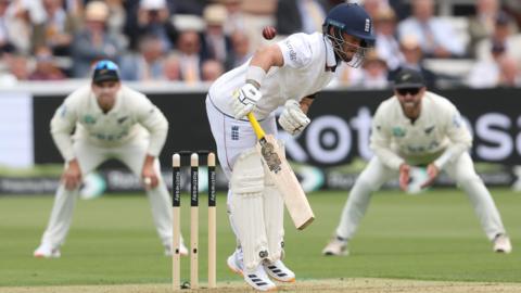 England opener Ben Duckett reacts after being struck by the ball