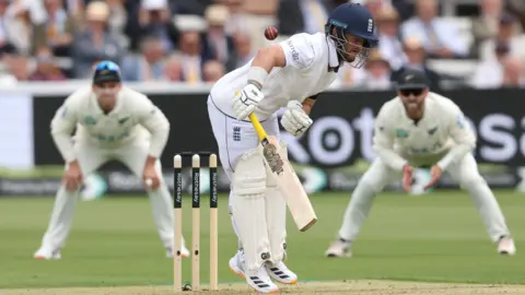 England opener Ben Duckett reacts after being struck by the ball