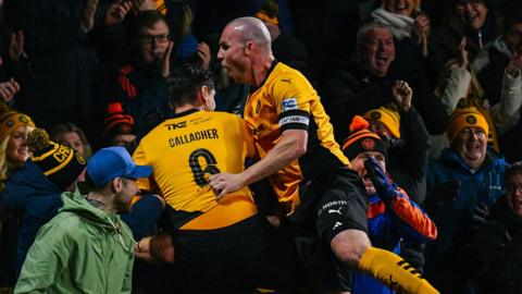 Carrick celebrate Luke McCulllough's goal