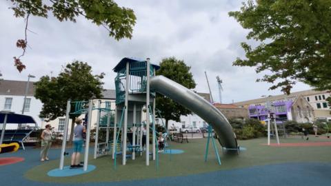 Tall metal slide and climbing equipment