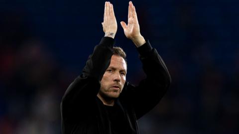 Wales boss Craig Bellamy applauds