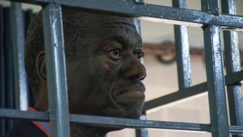 Ugandan opposition figure Kizza Besigye stands in the dock at the General Court Martial in Makindye, Kampala, Uganda, 20 November 2024