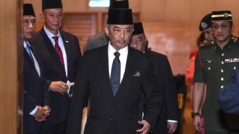 This pictures taken on January 11, 2019 shows Tengku Abdullah Sultan Ahmad Shah (C) walking after a meeting in Kuala Lumpur