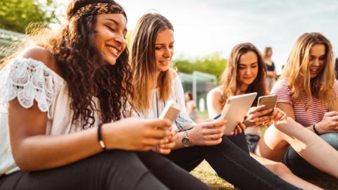 Young women on phones