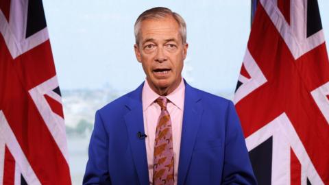 Farage speaks at a presser.