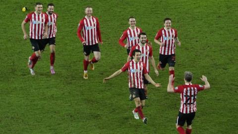 Sunderland players celebrate penalty win