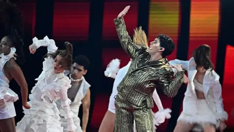 JJ performing on stage.