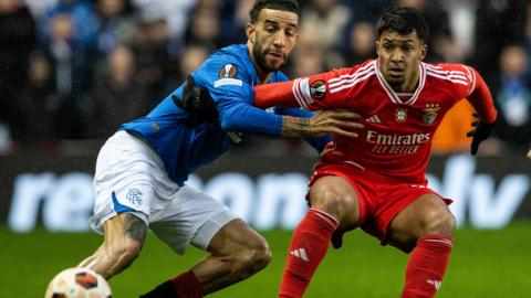 Rangers' Connor Goldson and Benfica's Marcos Leonardo