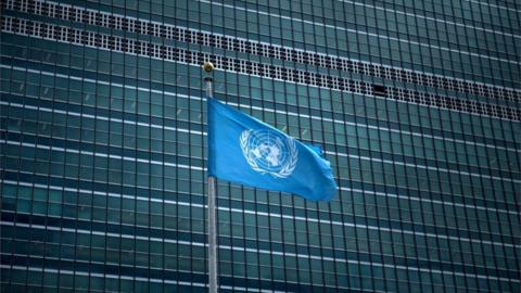 The UN flag waving outside its headquarters in Manhattan