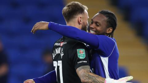 Cardiff City goalkeeper Jak Alnwick is congratulated by team mates
