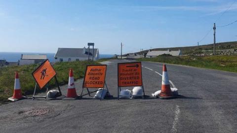 Road closure signs near the scene of the explosion