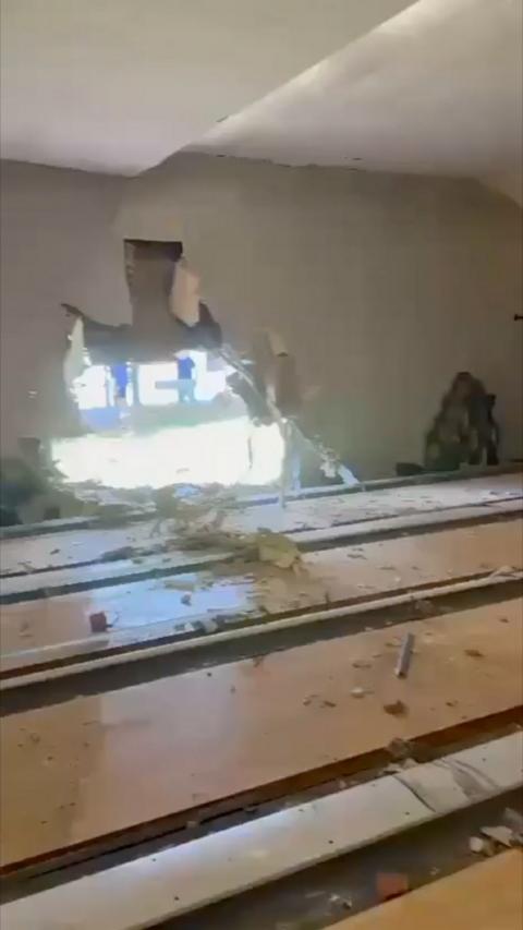 Hole in bowling alley wall