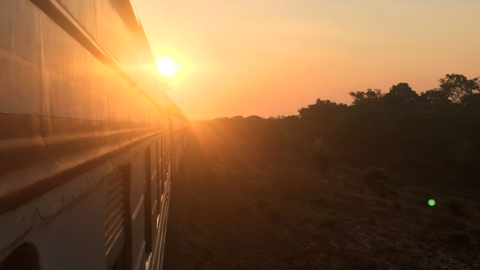 The sun pictured behind a Tazara train travelling from Tanzania to Zambia