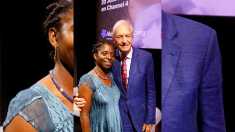 Dr Precious Lunga (left), wearing a blue dress and Jon Snow (right) wearing a blue suit.