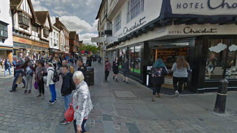 The junction of Canterbury High Street and St Margaret's Street, full of shoppers.