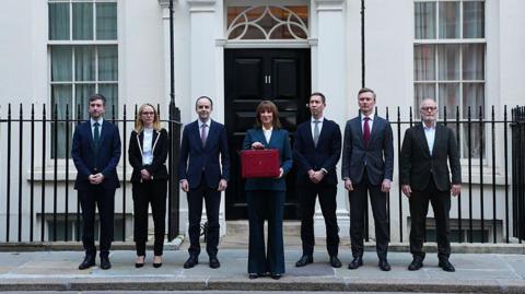 Members of the Treasury team flanked Rachel Reeves outside number 11 downing street.