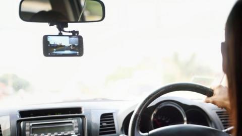 Stock image of a dash cam on a windscreen