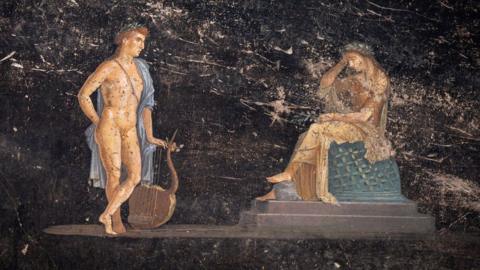 Apollo and Cassandra seen on an artwork uncovered at Pompeii