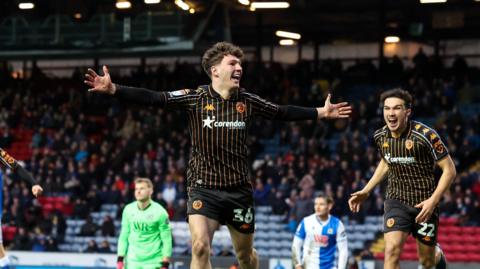 Lewis Koumas celebrating
