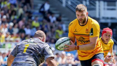 Iain Henderson carries the ball against Clermoint