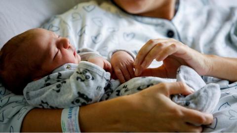 Baby in mother's arms