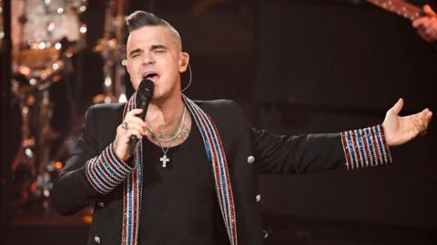 Robbie Williams performing in December 2019