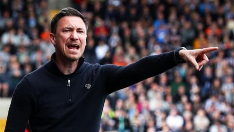 Stuart Maynard points and shouts instructions to his Notts County players during a game
