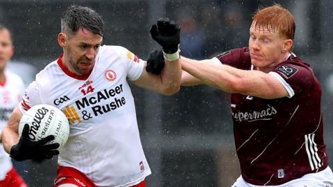 Tyrone's Mattie Donnelly attempts to get past Galway's Peter Cooke in Sunday's All-Ireland Championship Group Two game at Salthill