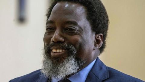 President of the Democratic Republic of the Congo (DRC) Joseph Kabila looks on in the hall of the Palais de la Nation in Kinshasa, on December 9, 2018 as he arrives for a press conference.