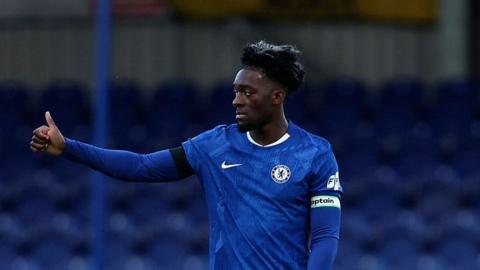 Alex Disasi does a thumbs up