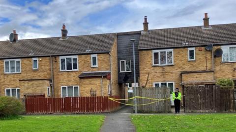 Police in front of house