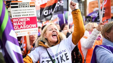 Thousands of women march in Glasgow in one of the biggest strikes over equal pay in the UK.