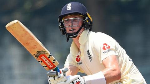 Close up of Zak Crawley after hitting a shot while batting for England in a tou match against a SLC Board President's XI