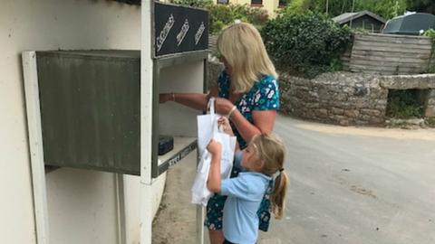 Winter and his Nana at the honesty box